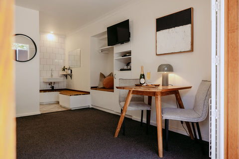 Small dining area with a table and chairs in a compact living space.